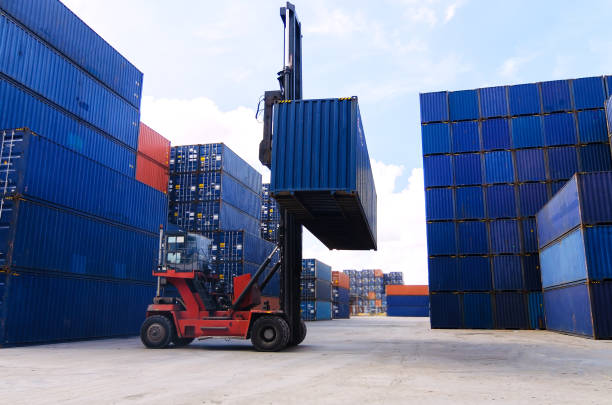 forklift handling container box loading to freight trainer